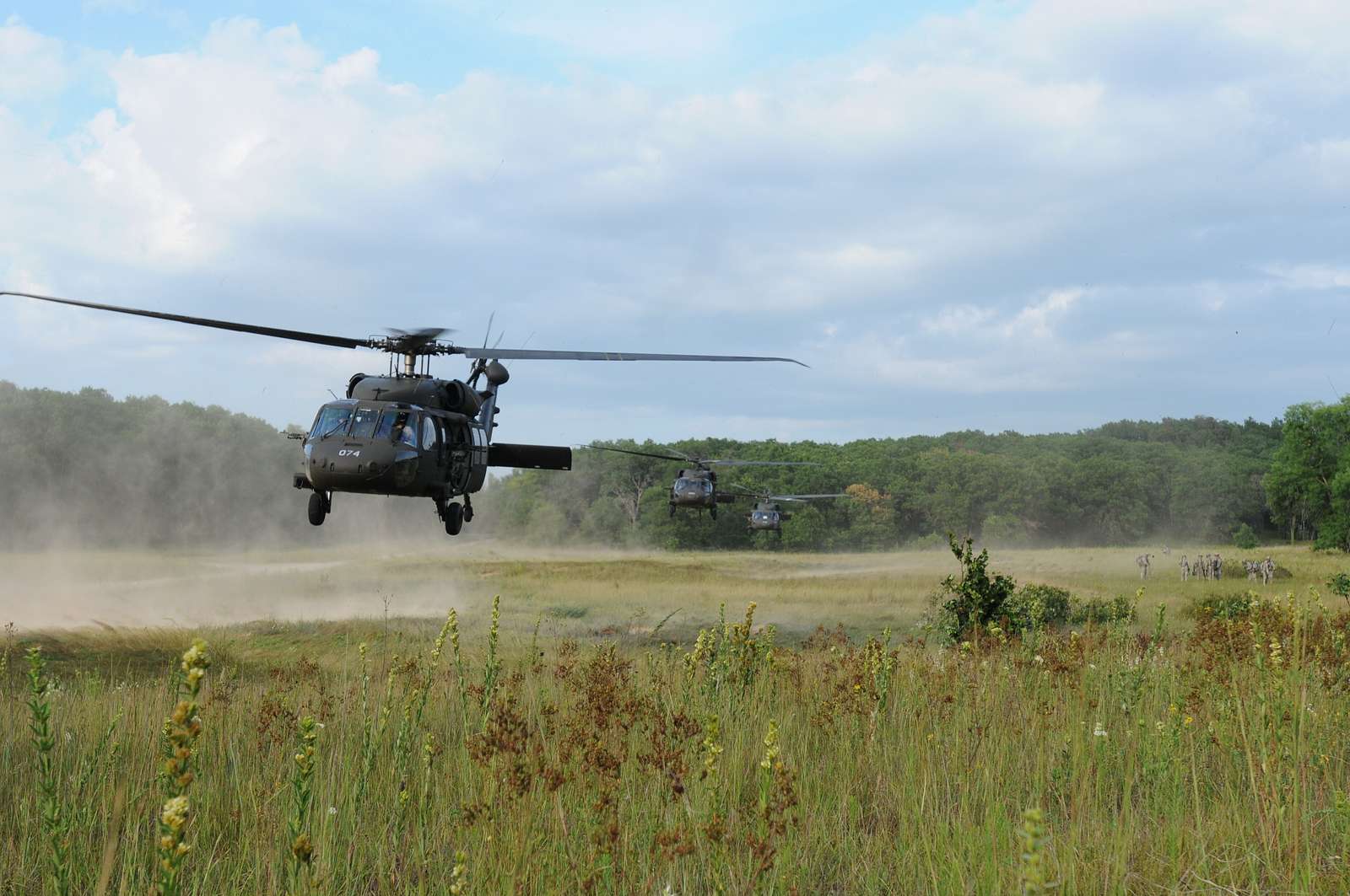 Three UH 60 Black Hawk Helicopters Take Off After Picking NARA