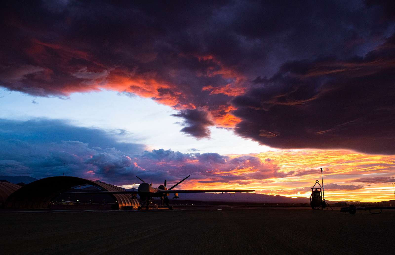 An Mq Reaper Sits On The Flight Line As The Sun Sets Nara Dvids