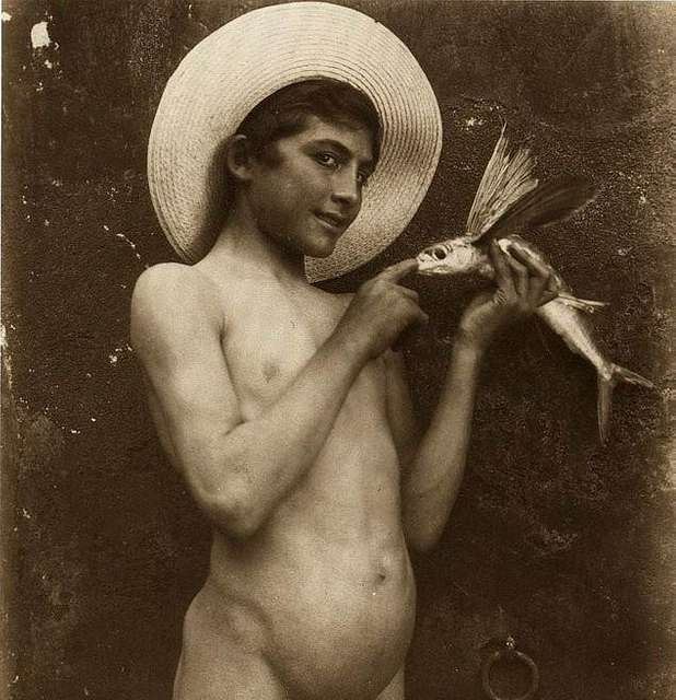 Boy With Flying Fish A Naked Woman In A Straw Hat Holding A Fish