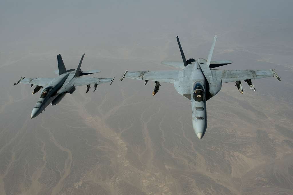 Two U.S. Navy F-A-18C Hornet Aircraft Depart After Receiving Fuel From ...