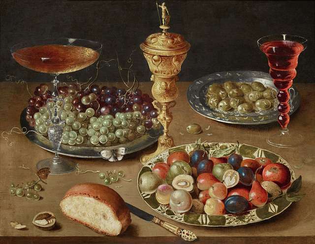 Still life with grapes on a tazza, a basket of fruit, two crayfish