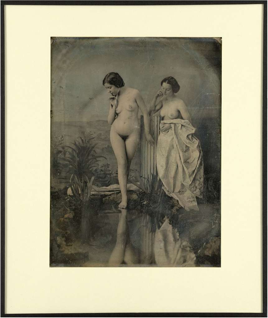 Shirtless man whipping two nude women crawling - PICRYL - Public