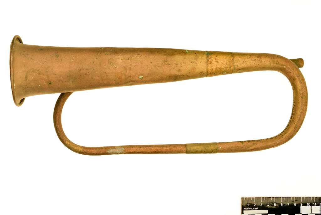 F73 Signalhorn - An old brass trumpet is shown on a white