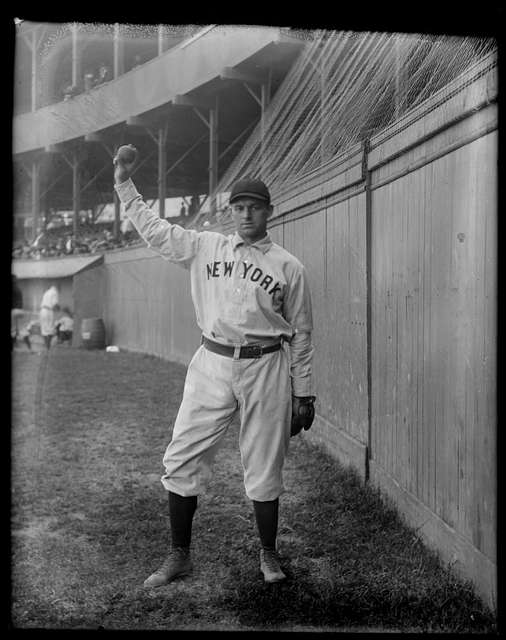 Hugh Duffy, full-length portrait, standing, facing slightly left, in baseball  uniform, hands on hips]