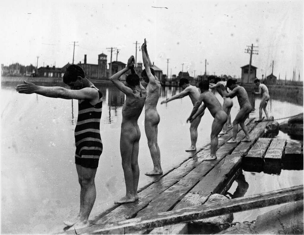 Nude swimmers and one man in a bathing suit about to dive into water  (I0003934) - PICRYL - Public Domain Media Search Engine Public Domain Search