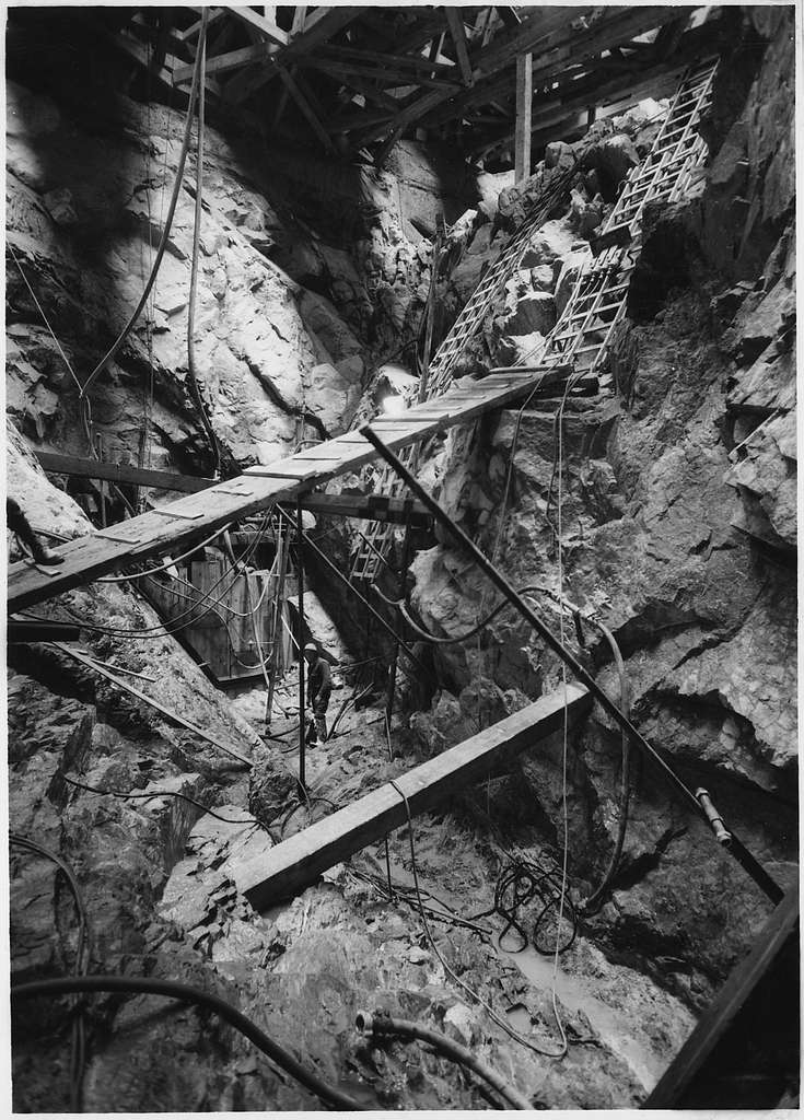 Excavation at a seam in bedrock at block 40-A. The depth below timber ...