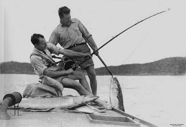File:Two older men enjoying fishing from boat one man is standing and  raising hat while showing the fish he just caught.jpg - Wikimedia Commons