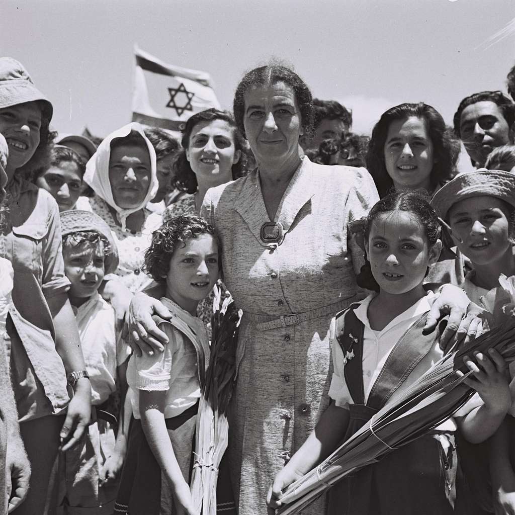 https://cdn2.picryl.com/photo/1950/07/24/golda-meir-with-children-of-kibbutz-shfayim-96322f-1024.jpg