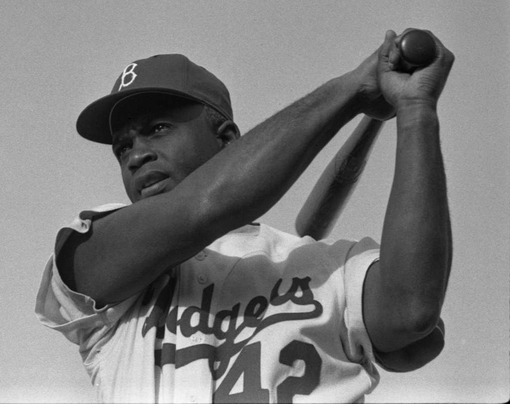 Jackie Robinson in Brooklyn Dodgers uniform, swinging bat Framed Print by  American Photo - Pixels