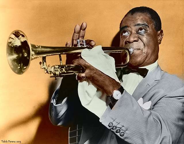 Louis Armstrong 1947 - A man in a blue suit playing a trumpet - PICRYL -  Public Domain Media Search Engine Public Domain Search