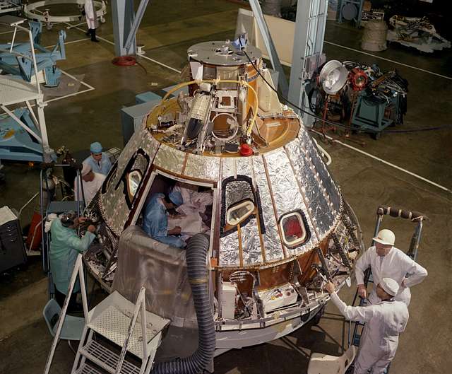 View of Spacecraft 012 Command Module during installation of heat ...