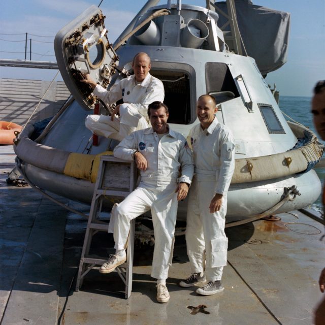 Apollo 10 astronauts in space suits in front of Command Module - PICRYL Public Domain Image