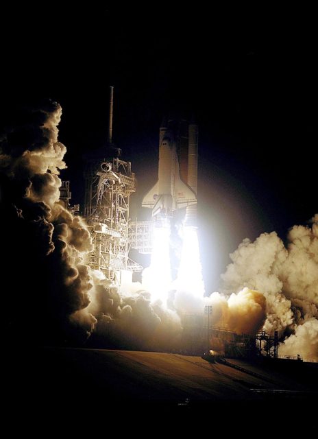 KENNEDY SPACE CENTER, FLA. -- Against a black moonless sky, Space ...