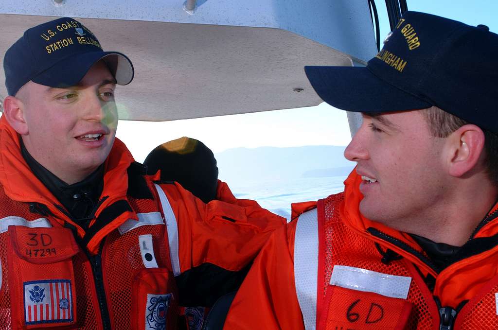 US Navy Engineman 2nd Class Anthony Bartelli (right) holds an