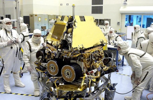 KENNEDY SPACE CENTER, FLA. - During processing, workers in the Payload ...