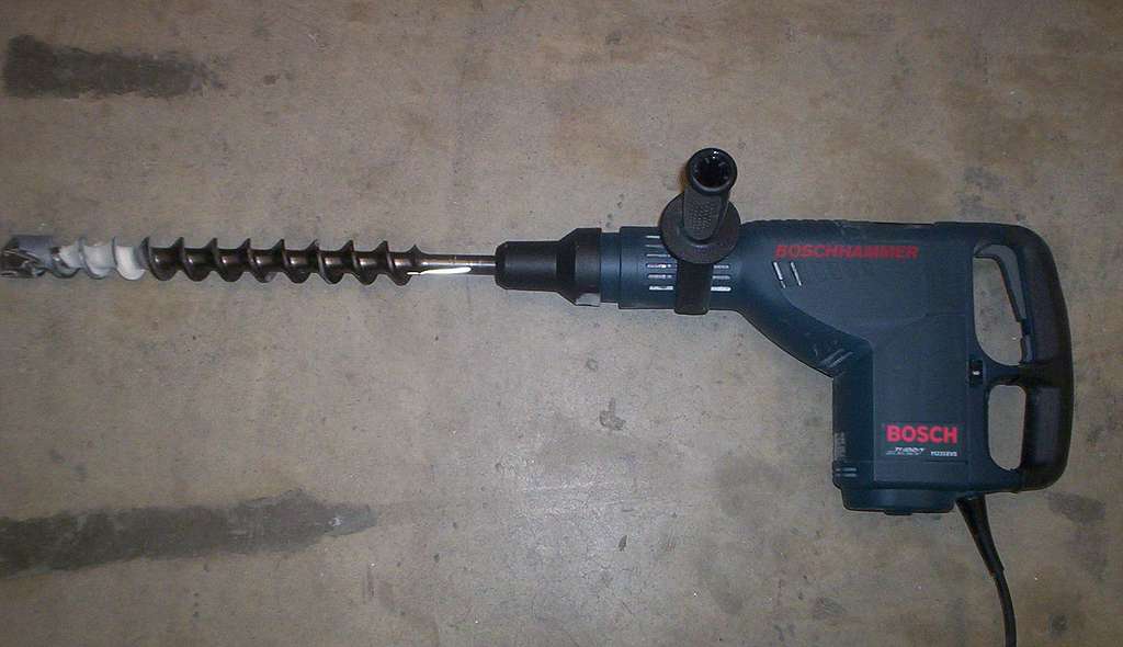 Bosch 11235EVS loaded A drill is laying on the floor next to a