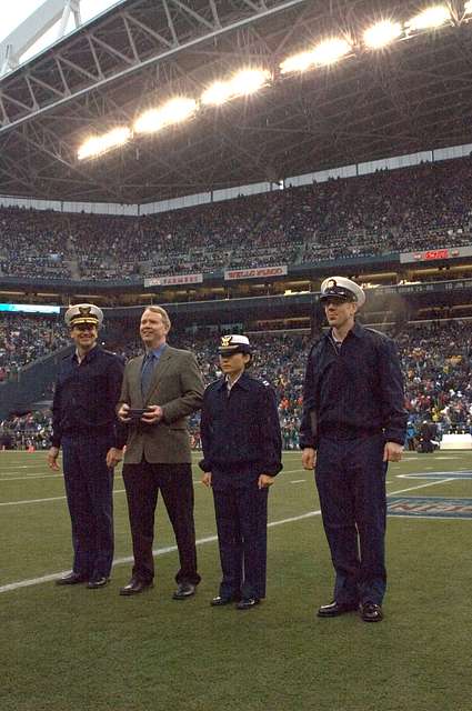 446th AW passes Seahawks' 12th-Man flag to Coast Guard > 446th