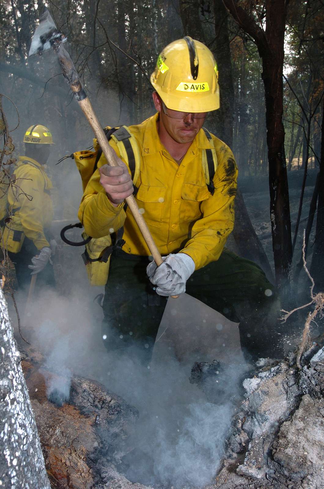 smoke-billows-out-of-a-charred-log-as-pfc-cliff-davis-nara-dvids