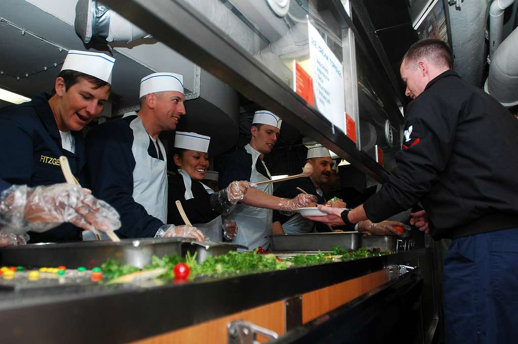 US Navy 070115-N-3411A-019 Chiefs onboard the nuclear-powered aircraft  carrier USS Nimitz (CVN 68) dish out the ice cream during an ice cream  social - PICRYL - Public Domain Media Search Engine Public