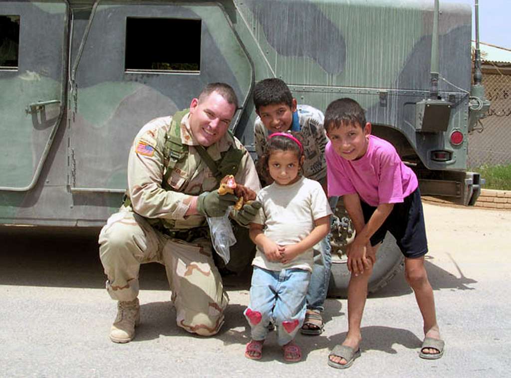 Army Lt. Col. James Barker and Sara show off Courage NARA