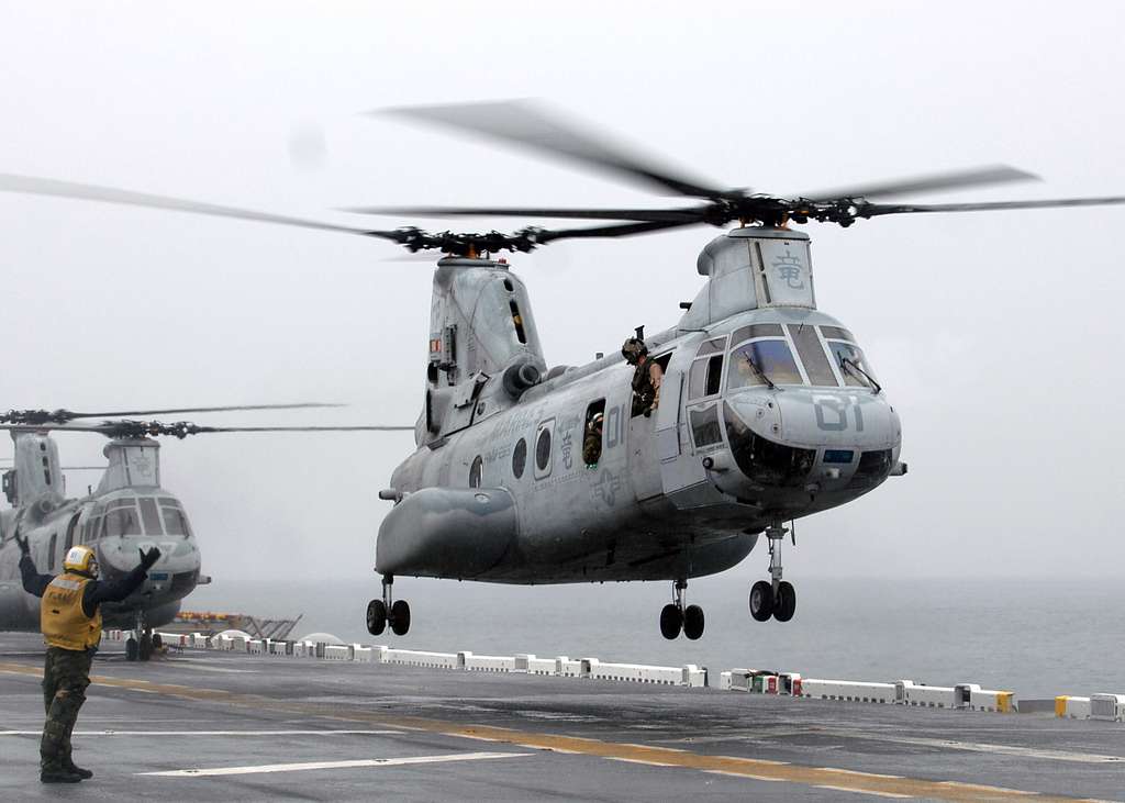 CH-46E Helicopter departs flight deck - NARA & DVIDS Public Domain