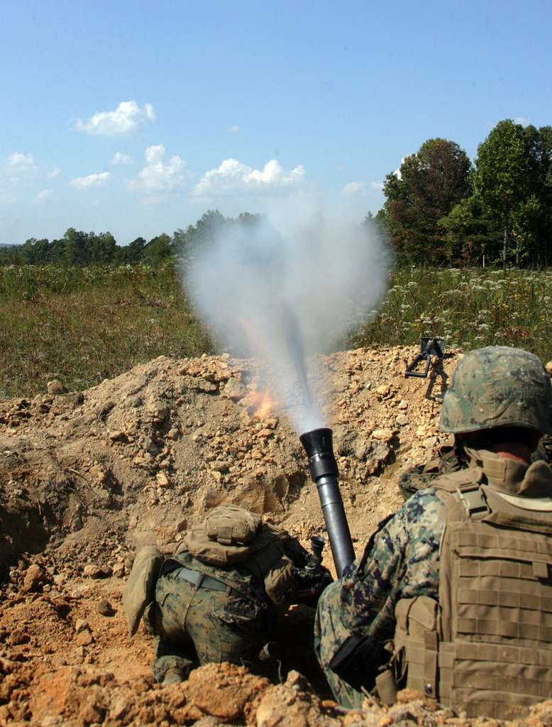 A high-explosive projectile streaks out of an 81mm - PICRYL - Public ...