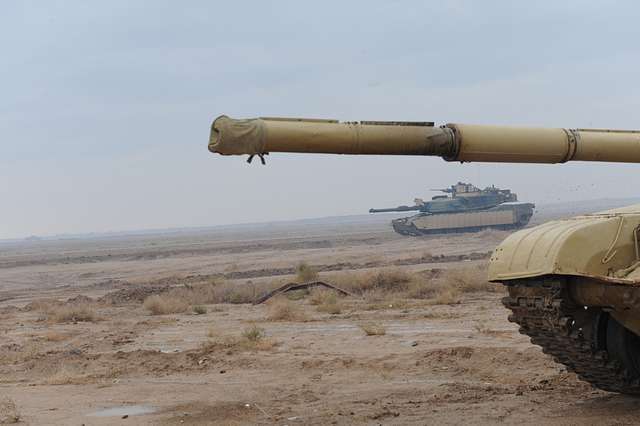 A U.S. Army M1A1 Abrams Tank Drives Past An Iraqi T-72 - NARA & DVIDS ...