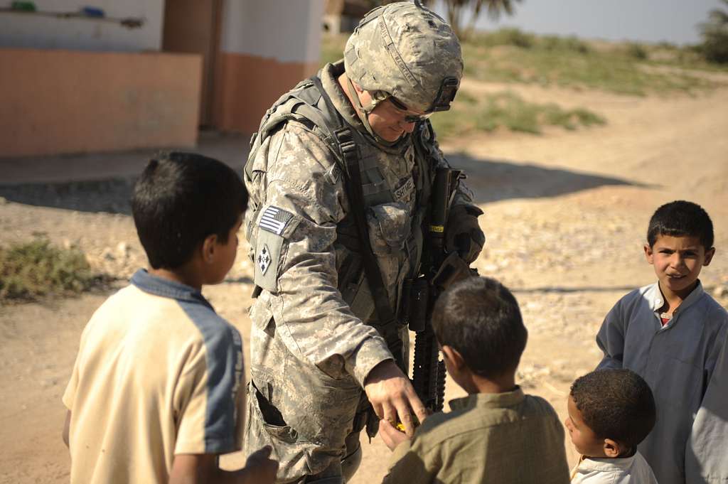 Iraqi children talk with U.S. Army Spc. Heath Mashtare - NARA