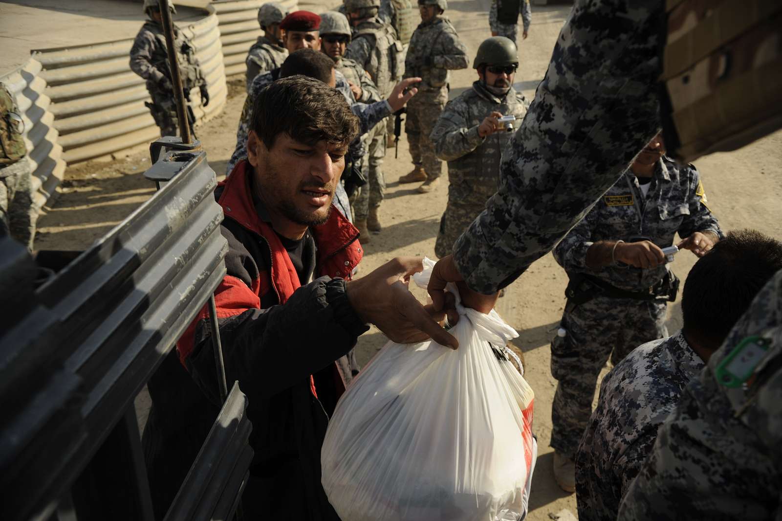 An Iraqi man receives food from 2nd Battalion, Iraqi - NARA & DVIDS ...