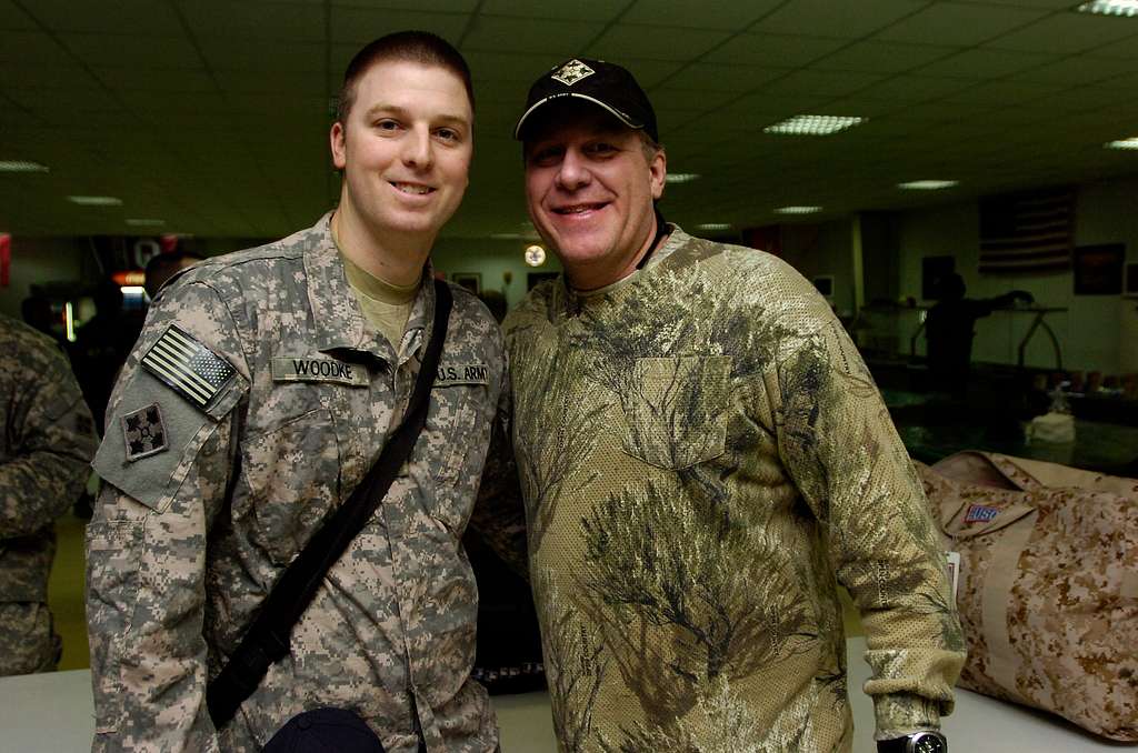 Boston Red Sox pitcher Curt Schilling poses for a picture with