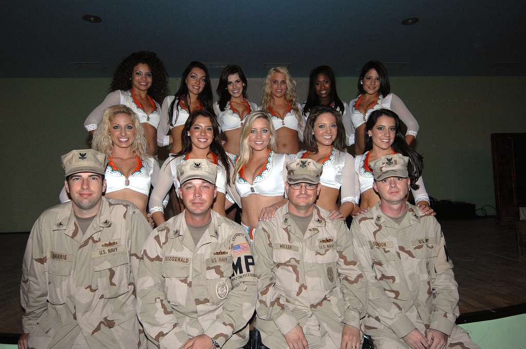 Miami Dolphins cheerleaders pose with Navy military police during a visit  to Camp Lemonier, Djibouti, Jan 23, 2009. Camp Lemonier is the hub of the  Combined Joint Task Force, Horn of Africa