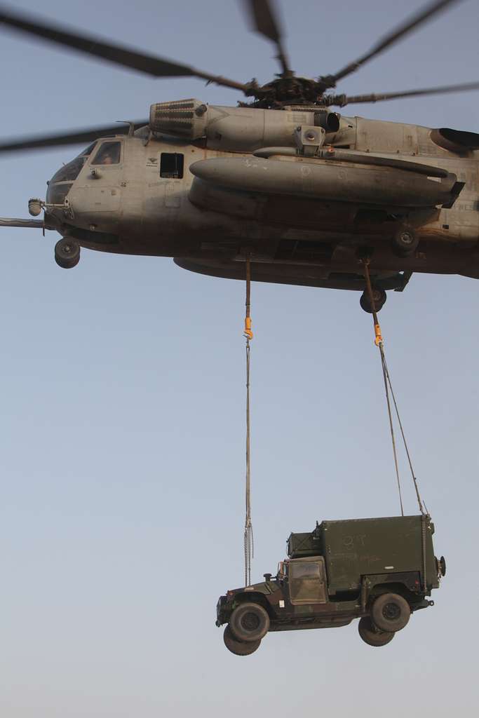 A CH-53E Super Stallion lifts a Humvee for transport - NARA & DVIDS ...