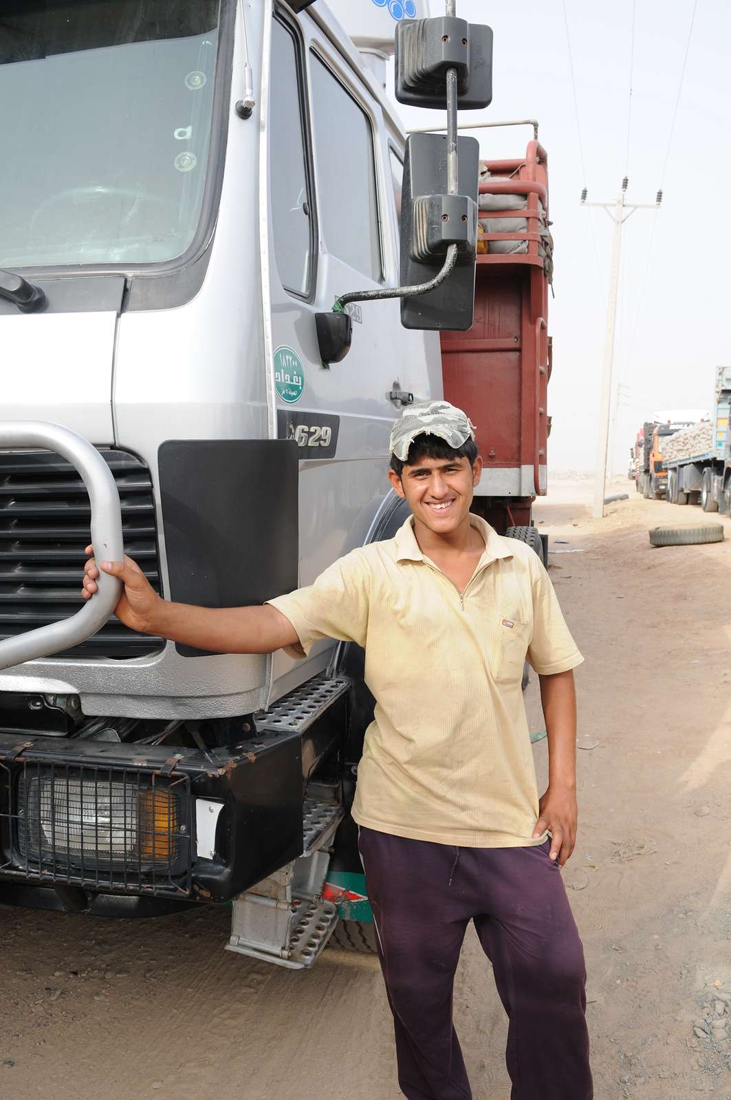 A truck driver poses with his tractor trailer at the - NARA & DVIDS ...