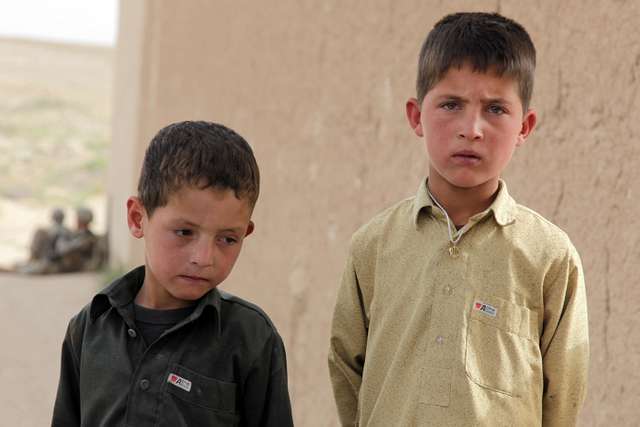 Afghan children stand next to eachother while their - NARA & DVIDS ...