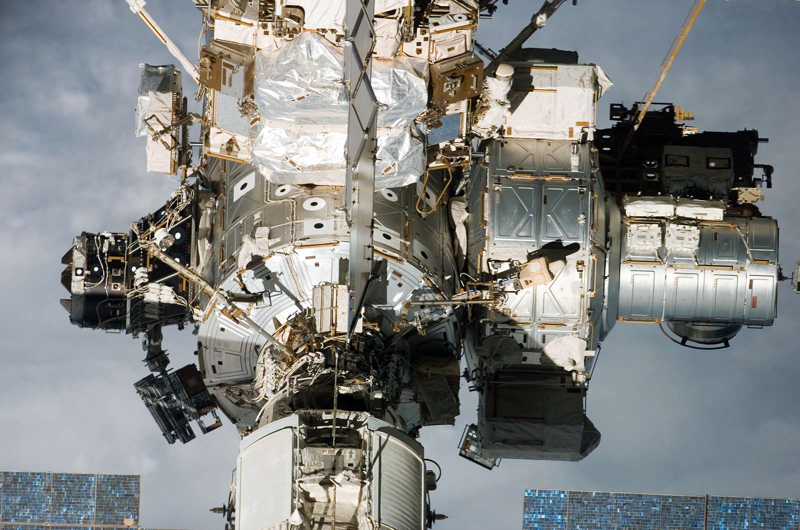 Flyaround view of the zenith and aft sides of the PMA-3, Z1 Truss, A/L ...