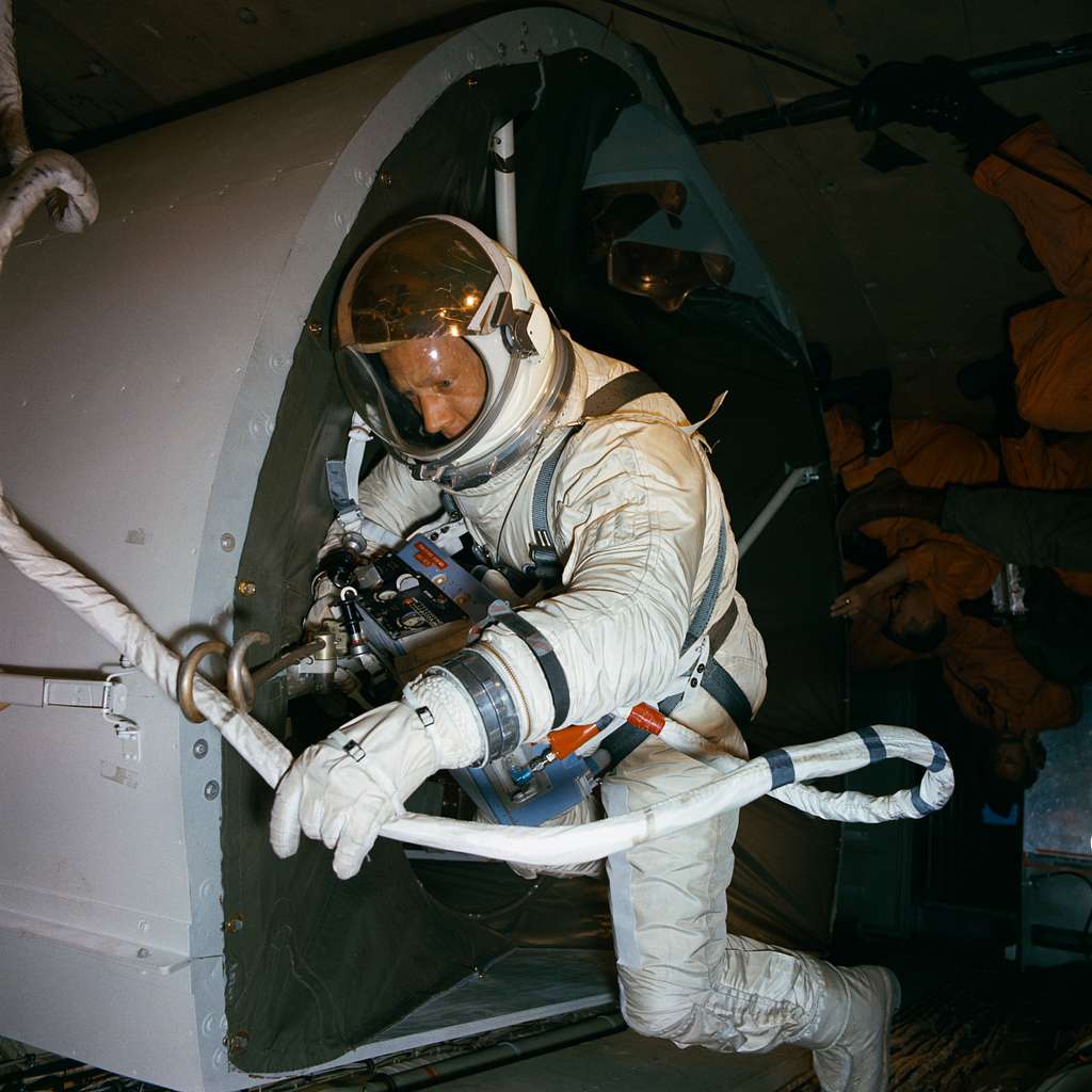 Astronaut Edwin Aldrin practices tether attachment aboard KC-135 ...