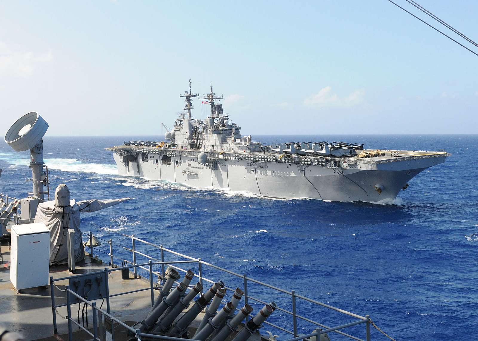 The amphibious assault ship USS Kearsarge cruises alongside - NARA