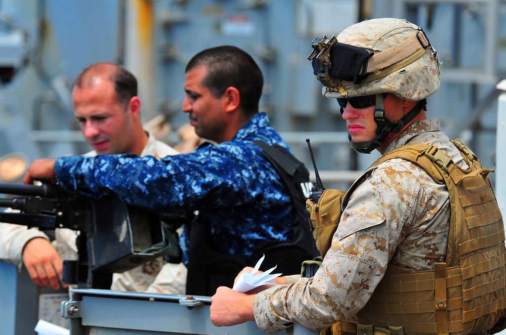 Sailors and Marines man a .50-caliber machine gun on - PICRYL Public ...