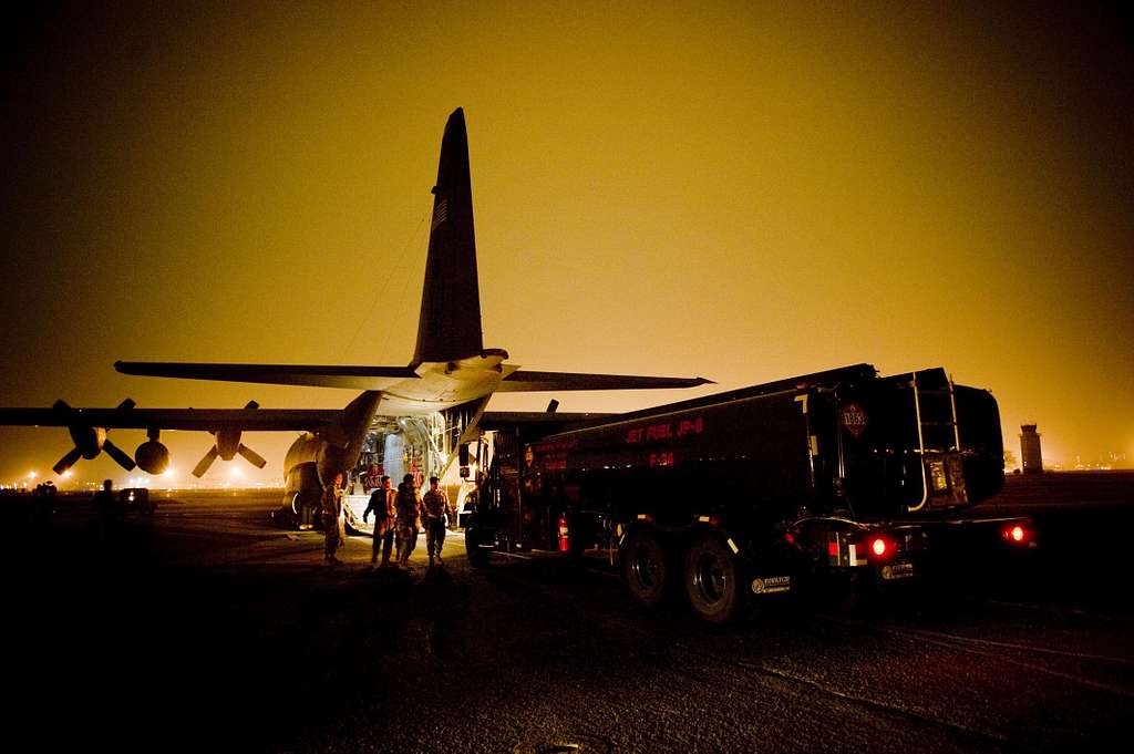 A fuels truck pulls up to an C130H Hercules to be NARA & DVIDS