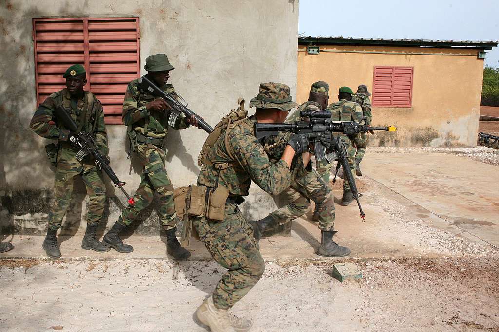 A fire team of Senegalese Commandos creates a stack - PICRYL