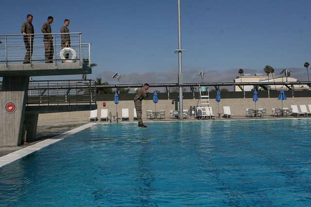 A Marine jumps off the tower at the Miramar swim tank - NARA & DVIDS ...