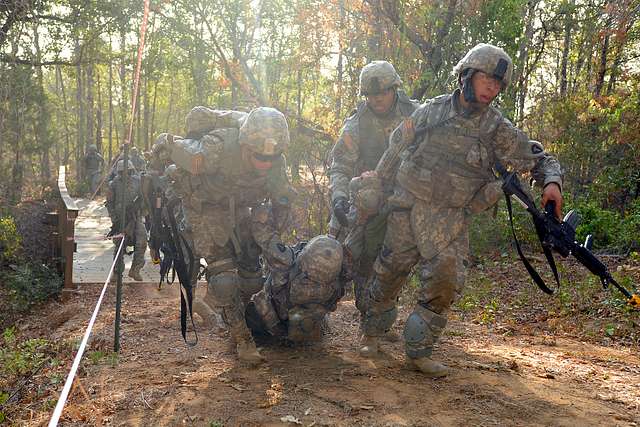 Spc. Jaime Rios (far right), along with fellow Guardsmen, - NARA ...