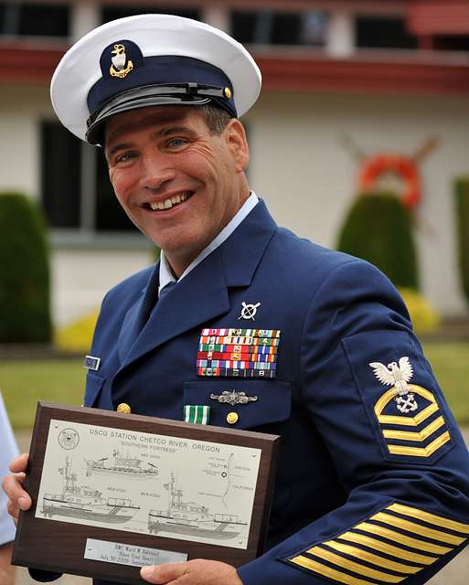 US Navy Engineman 2nd Class Anthony Bartelli (right) holds an