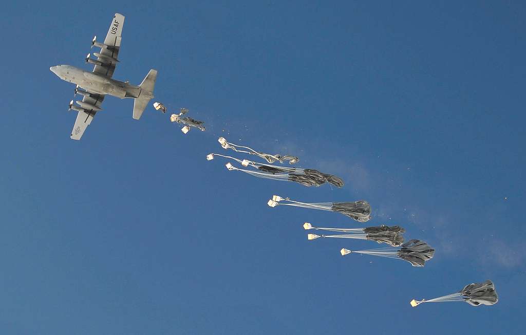 A C-130 aircraft drops pallets of supplies in Shah - NARA & DVIDS ...