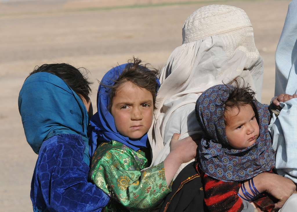 An Afghan family ride on a motorcycle up to a checkpoint - NARA & DVIDS ...