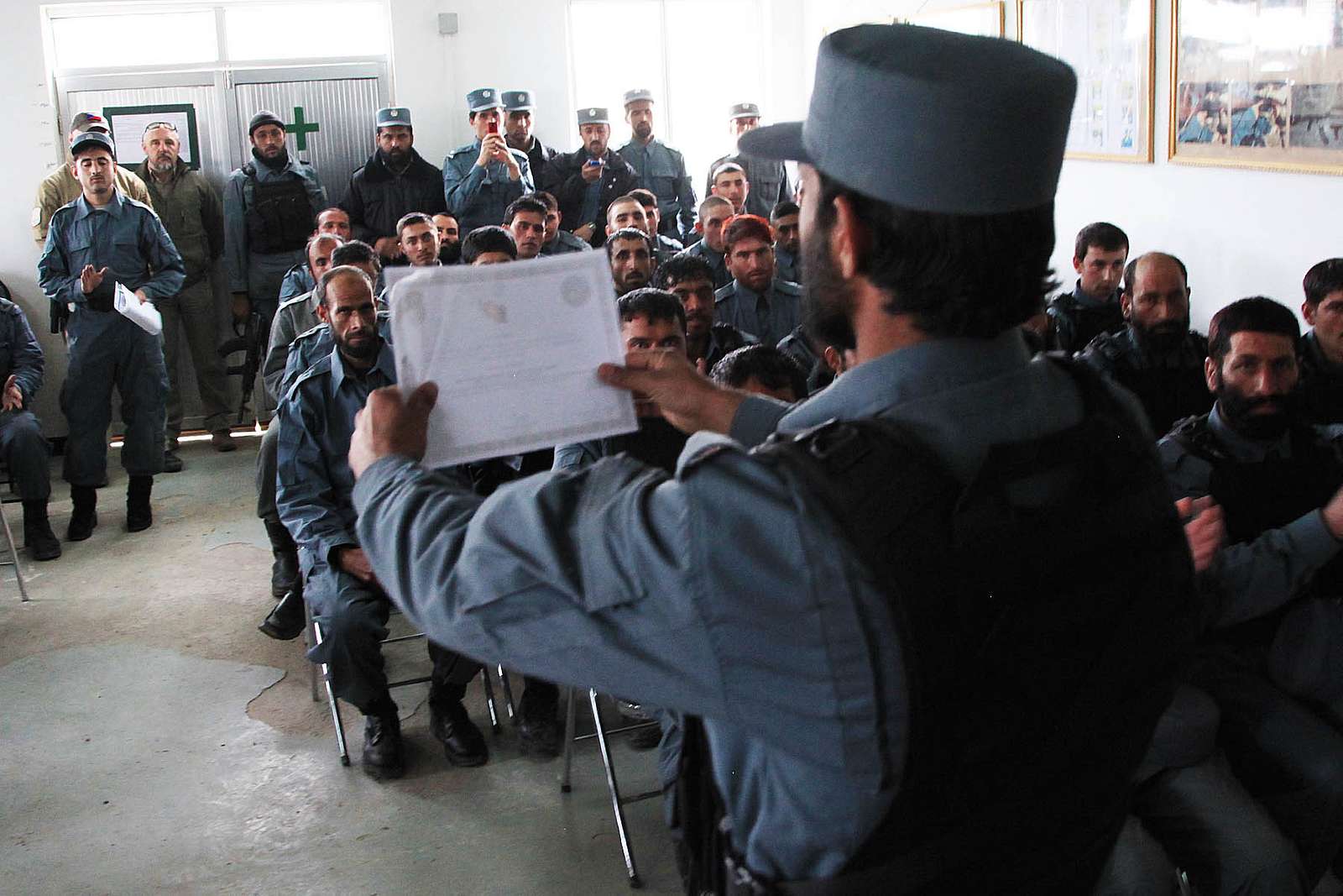 An Afghan Uniformed Police Officer Holds Up A Certificate - U.S ...