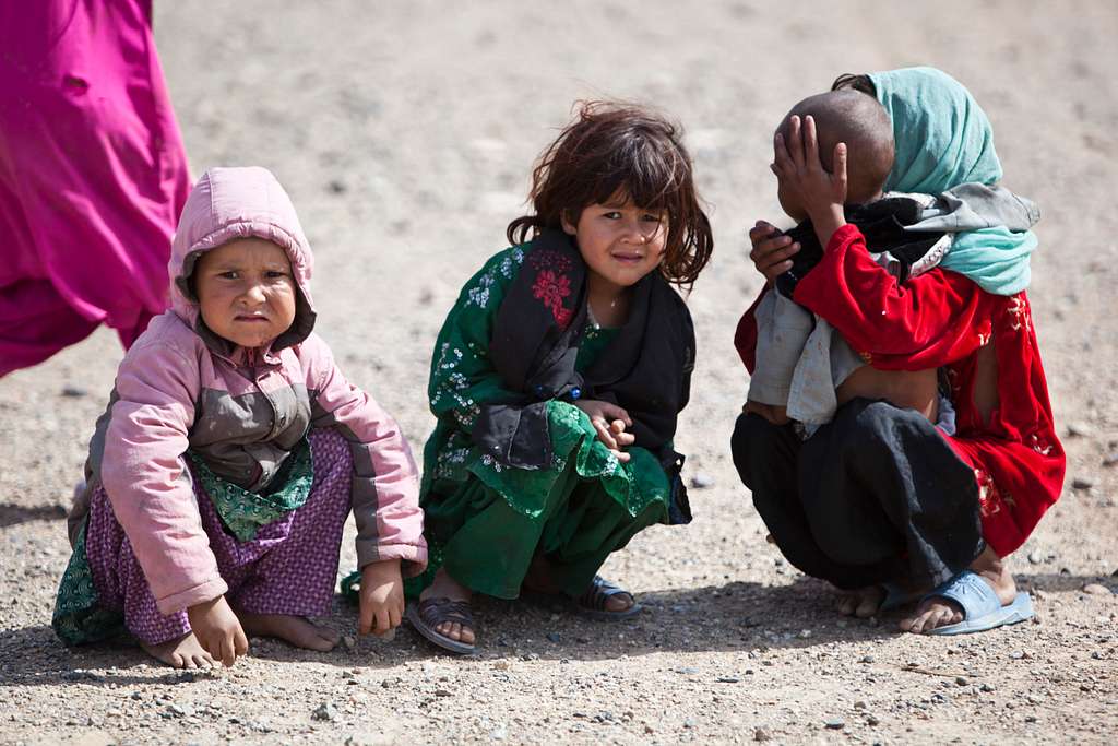 Afghan children squat and watch village elders engage - PICRYL Public ...