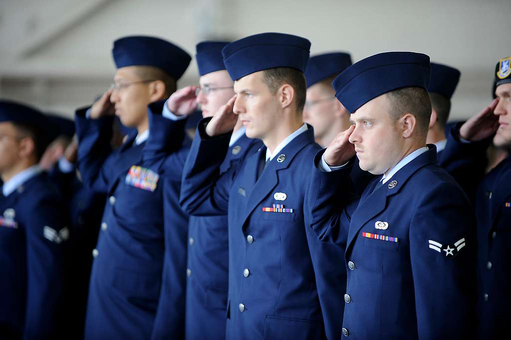 Airmen with the 673d Air Base Wing give their 