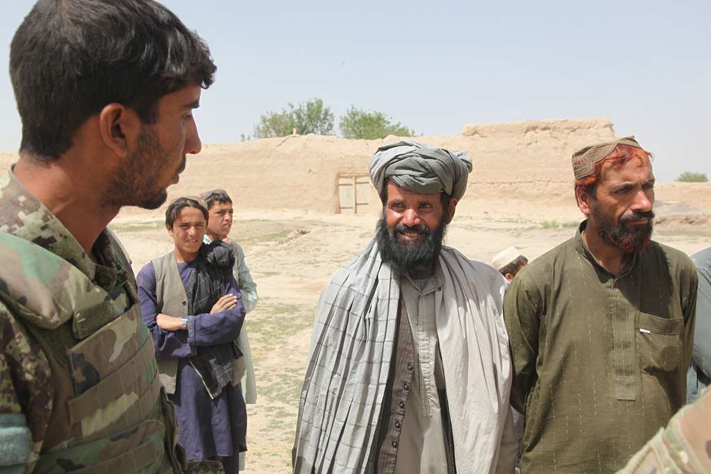 An Afghan National Army soldier talks to village elders - NARA & DVIDS ...