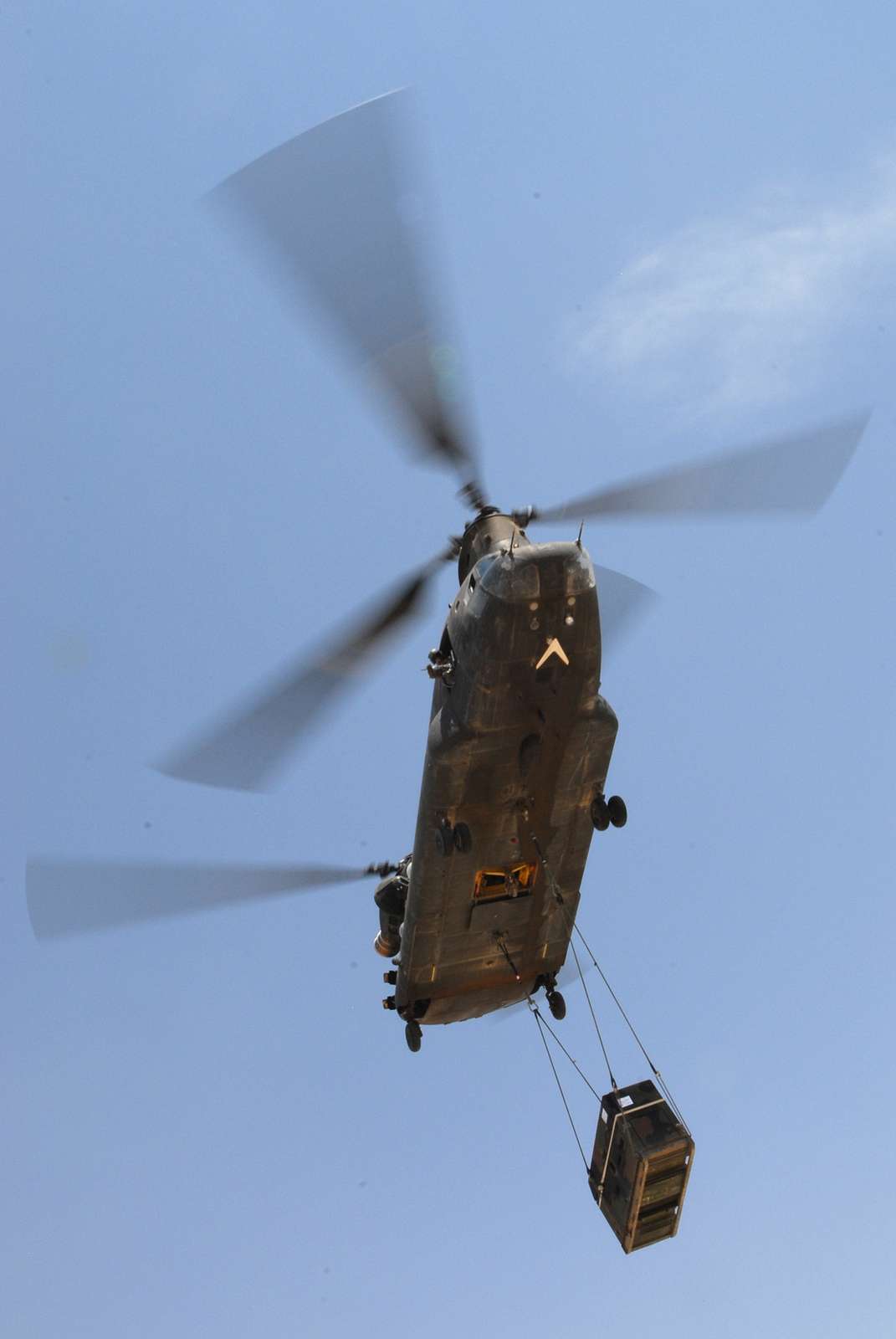 A U.S. Army CH-47 Chinook helicopter sling loads a - NARA & DVIDS ...